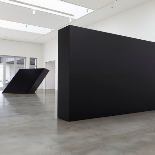 A large black rectangular object in a room Description automatically generated