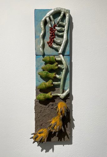 A piece of art on a wall Description automatically generated