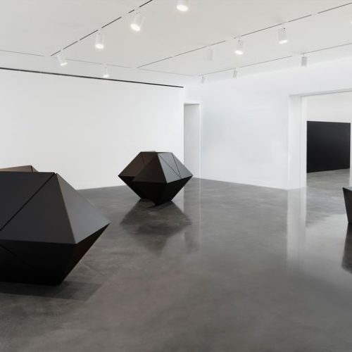 A room with black objects Description automatically generated