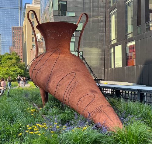 A sculpture in a garden Description automatically generated