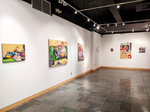 A room with art on the wall Description automatically generated