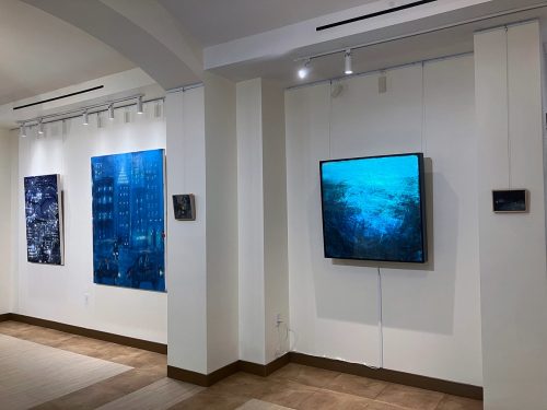 A room with art on the wall Description automatically generated