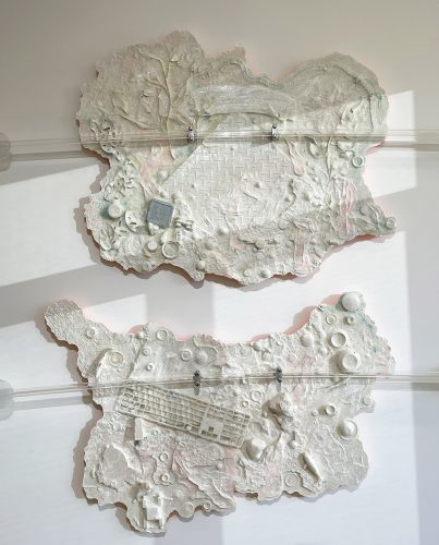 A white and pink piece of art Description automatically generated