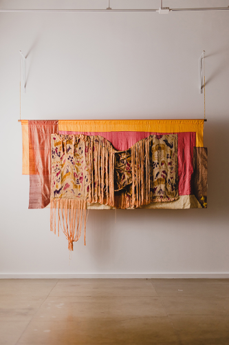 A fabric with fringes Description automatically generated with medium confidence