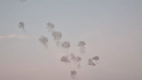 A group of smoke in the sky Description automatically generated