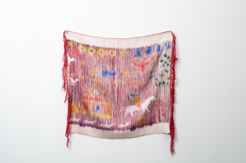 A red and white scarf with fringes Description automatically generated with medium confidence