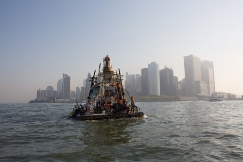A boat with people on it in the water Description automatically generated