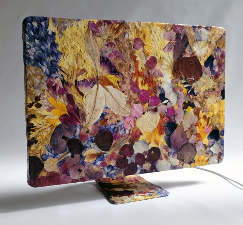 A computer screen with a flower covered surface Description automatically generated