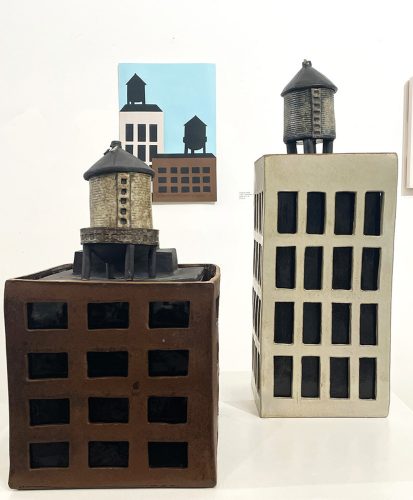 A couple of ceramic buildings Description automatically generated
