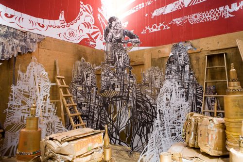 A room with a painting of a person Description automatically generated with medium confidence