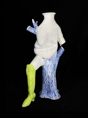 A statue of a person with a green boot Description automatically generated