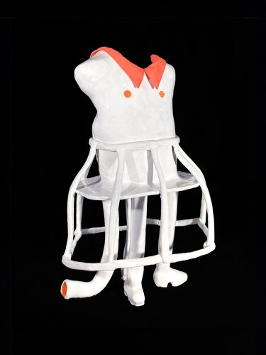 A white and orange plastic mannequin Description automatically generated