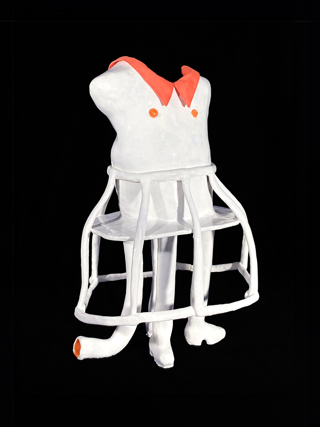 A white and orange plastic mannequin

Description automatically generated