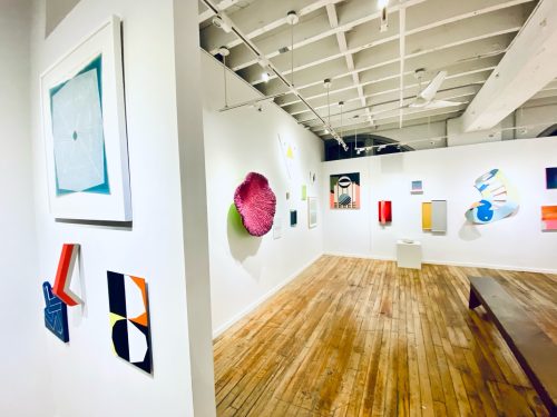 A room with art on the wall Description automatically generated