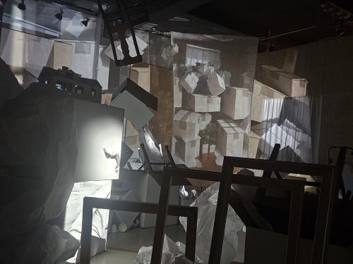 A room with many pieces of cardboard Description automatically generated