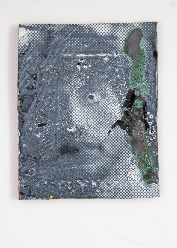 A close-up of a grey and black tile Description automatically generated