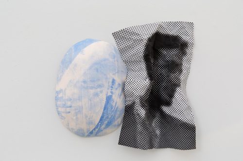 A piece of paper next to a piece of paper Description automatically generated