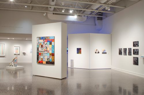 A room with art on the wall Description automatically generated