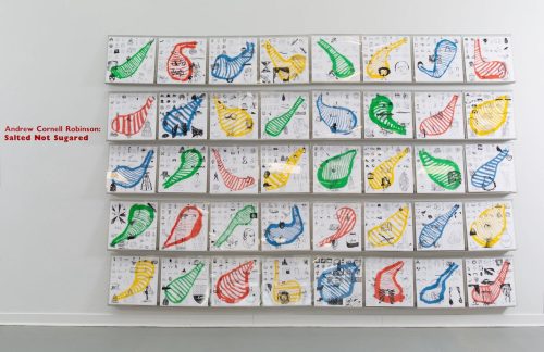 A wall with many drawings on it Description automatically generated with medium confidence