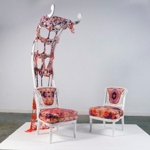 A chair and a chair made of fabric Description automatically generated