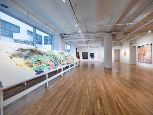 A large room with art on display Description automatically generated