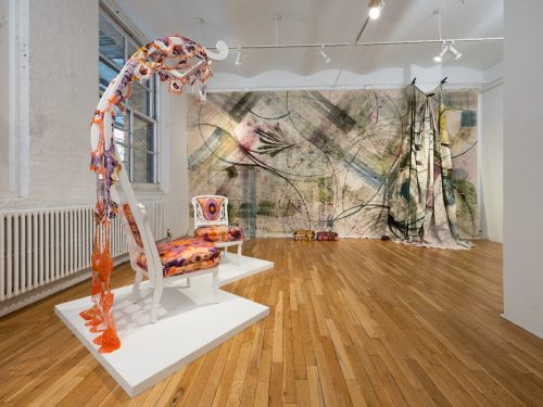 A room with a large painting Description automatically generated