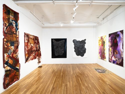 A room with art on the wall Description automatically generated