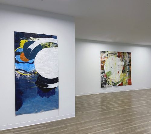 A room with art on the wall Description automatically generated