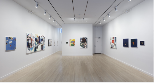 A room with art on the wall Description automatically generated