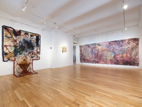 A room with art on the wall Description automatically generated