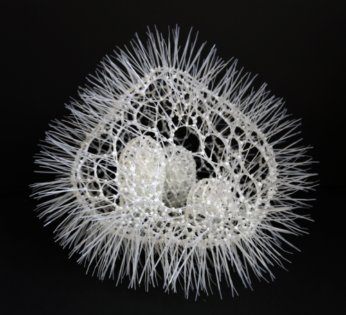 A white object with spikes Description automatically generated