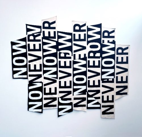 A group of black and white signs Description automatically generated