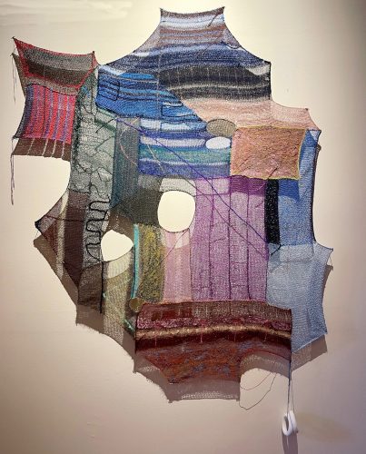 A piece of art on a wall Description automatically generated