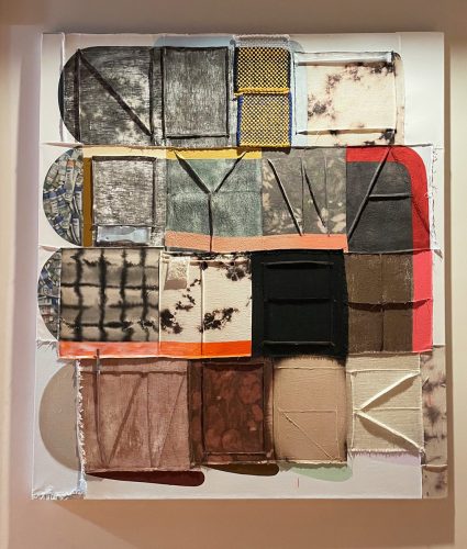 A piece of art on a wall Description automatically generated