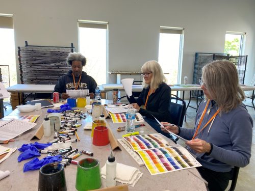 A group of people sitting at a table Description automatically generated