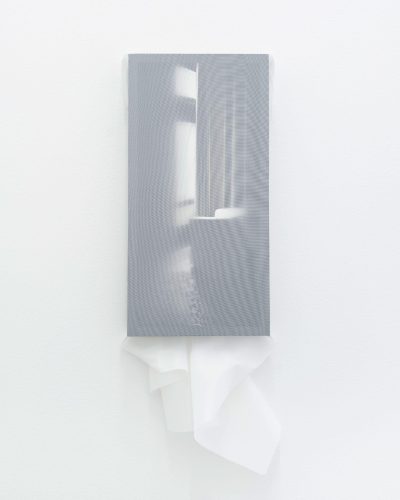 A tissue paper on a wall Description automatically generated