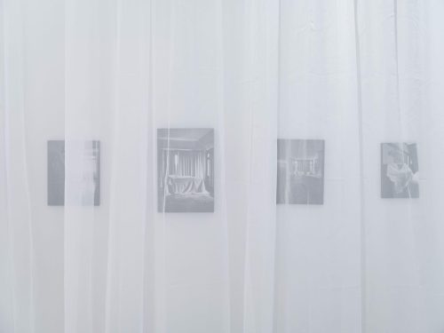 A white curtain with pictures on it Description automatically generated