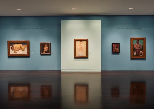 A room with art on the wall Description automatically generated