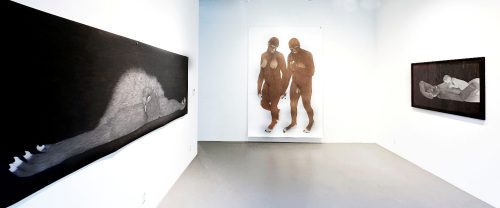 A couple of men in a room Description automatically generated