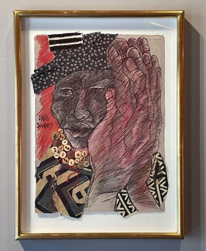 A framed piece of art Description automatically generated