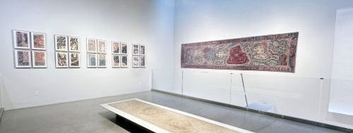 A room with a large carpet and a bench Description automatically generated with medium confidence