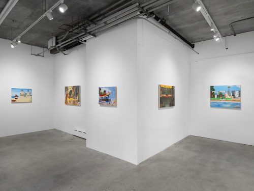 A room with several paintings on the wall Description automatically generated