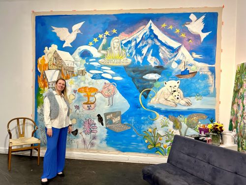 A person standing in front of a mural AI-generated content may be incorrect.