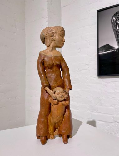 A statue of a person holding a baby AI-generated content may be incorrect.