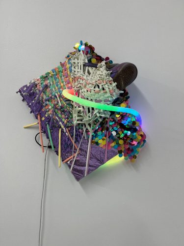 A piece of art made of plastic pieces AI-generated content may be incorrect.