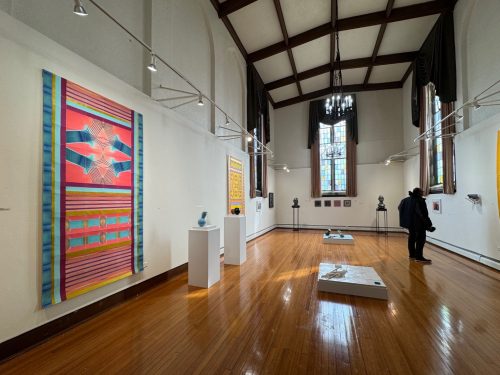 A room with art on the wall AI-generated content may be incorrect.