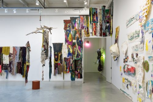 A room with art pieces on the wall AI-generated content may be incorrect.