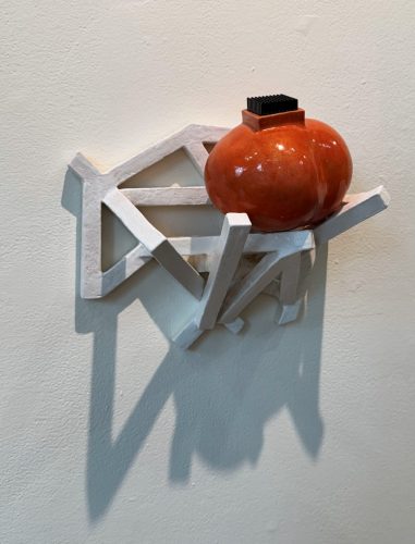 A sculpture on a wall AI-generated content may be incorrect.