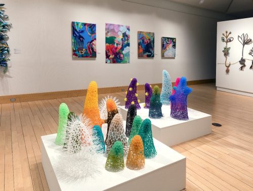 A group of colorful sculptures on display AI-generated content may be incorrect.