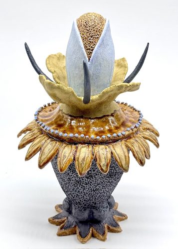 A sculpture of a flower AI-generated content may be incorrect.